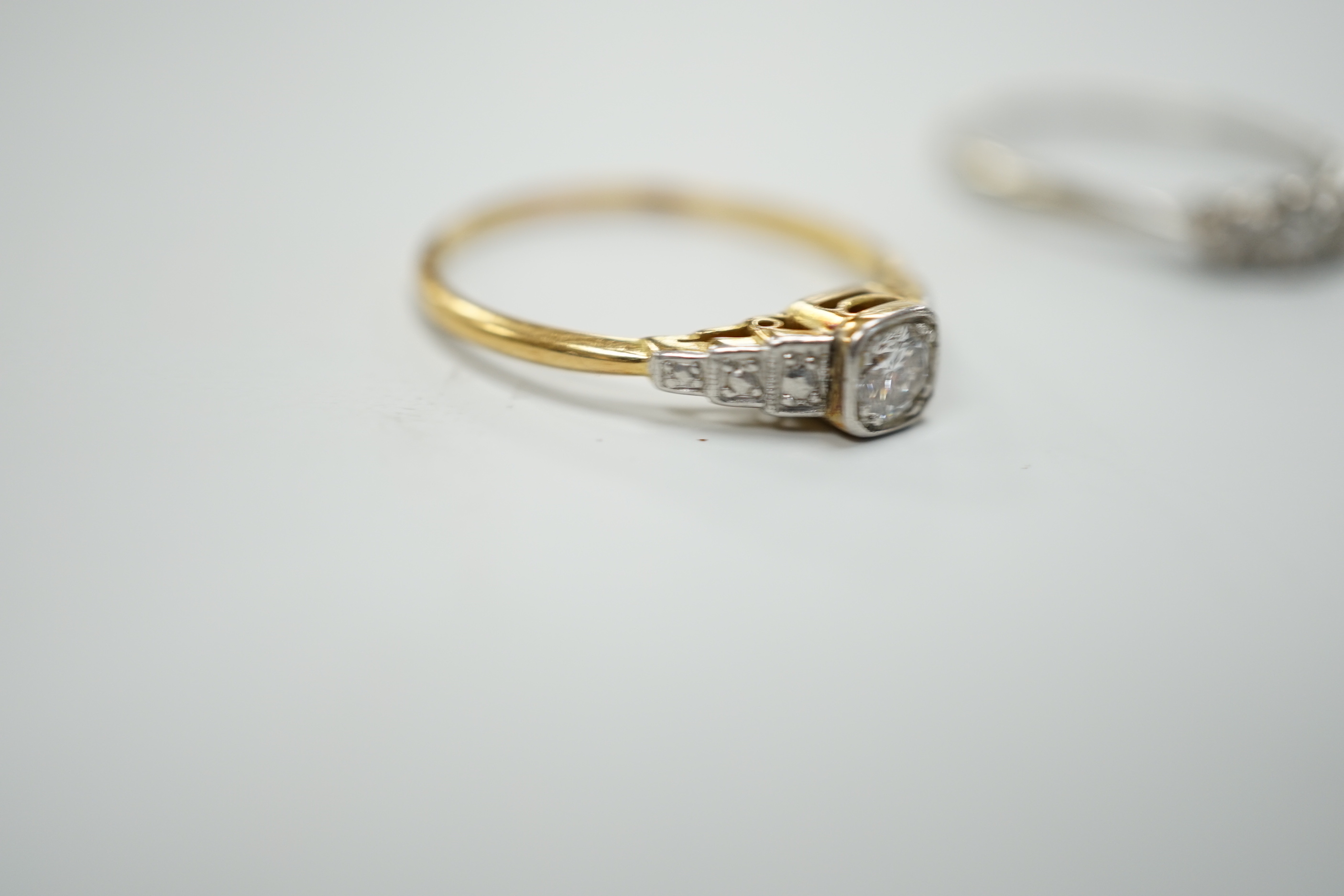 Two 18ct,plat and diamond set rings including single stone, size Q and three stone, size O/P, gross weight 4.3 grams.